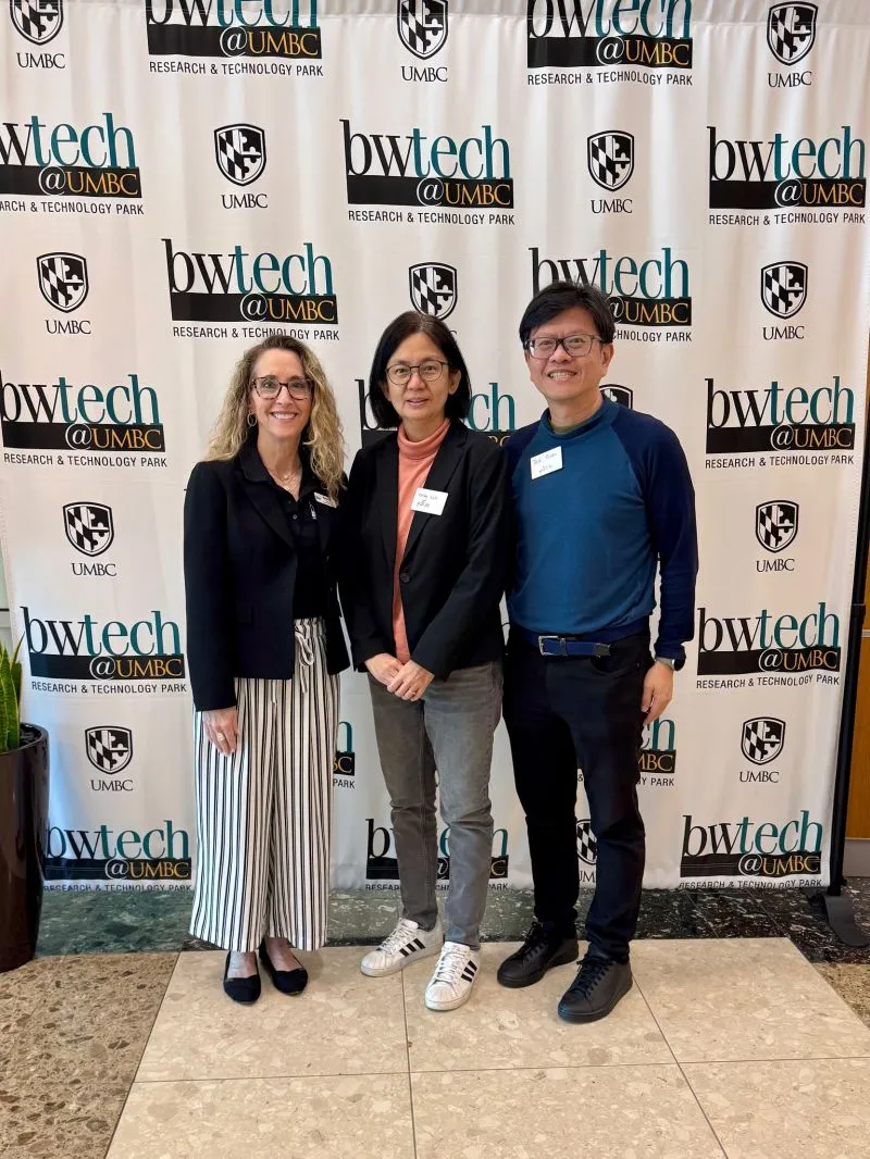 Photo of Ms Majorie Cota, Director Entrepreneurial Services bwtech@UMBC with pQCee co-founders, Ms Chay Hiah Loh and Dr Teik Guan Tan